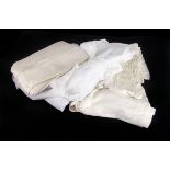 A small quantity of linen and lace, including three christening robes, doilies, table cloths and