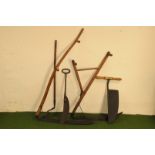 Two vintage scythes, one with split handle, the other a long handled example, together with a