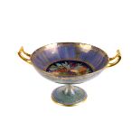 A Minton's lustre glaze pedestal fruit bowl,  decorated to the centre of the bowl with fruit amid