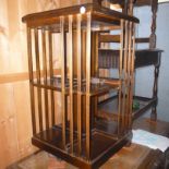 A late  20th century mahogany revolving bookcase,  with square central column, 85cm  high