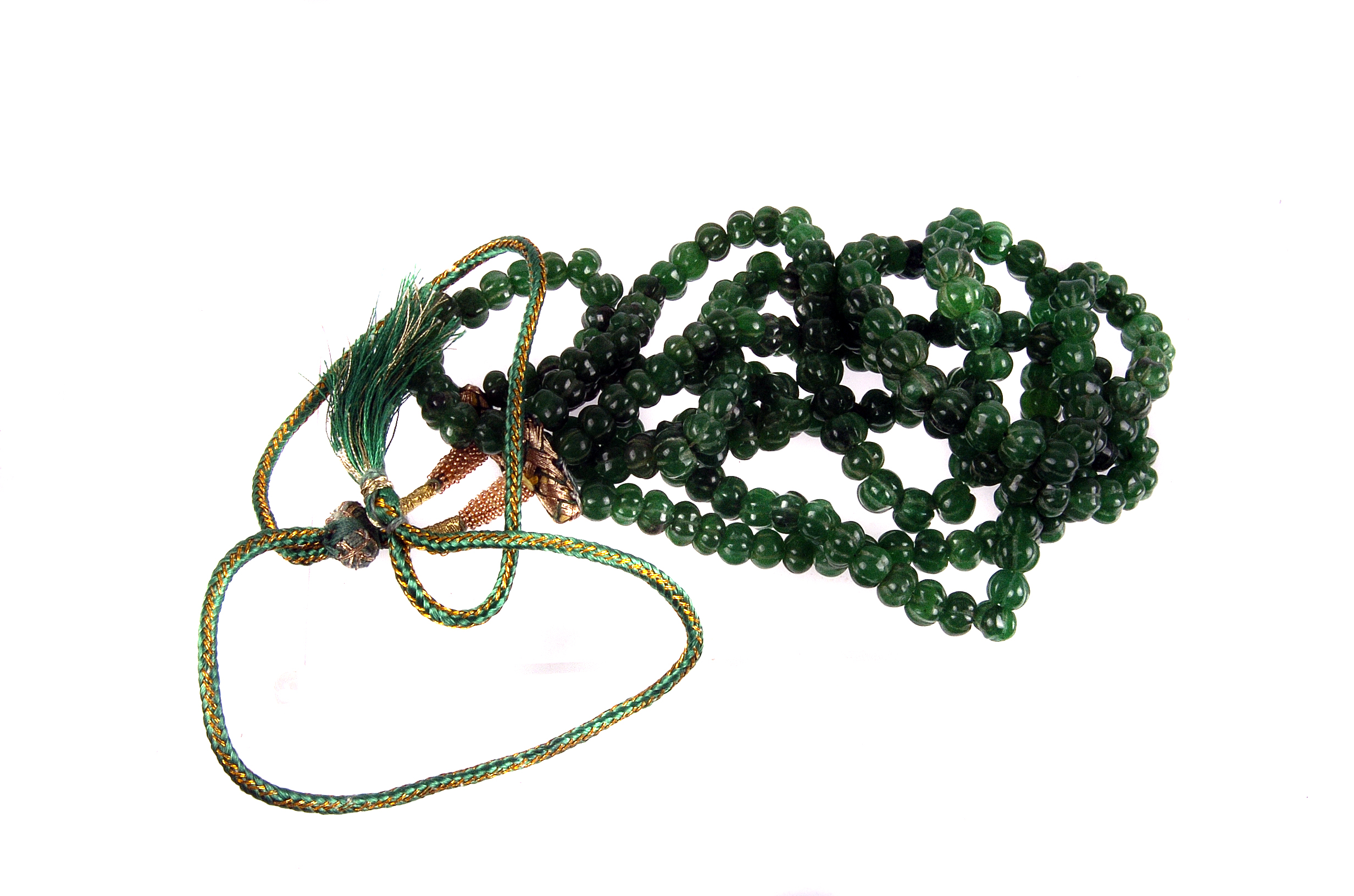 An emerald bead three strand necklace,  composed of graduated melon cut beads, to a silk cord tie