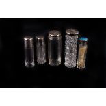 A group of early 20th century silver capped or collared scent bottles,  each of cylindrical form (5)