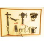 A collection of eight vintage and modern animal traps, including Lloyd trap, Juby trap, Fenn trap