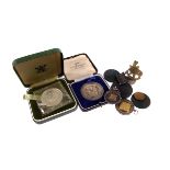 A collection of coins and medallions, including two silver and gold Ardingly College sporting