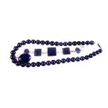 A suite of lapis lazuli jewellery,  to include bead necklace, silver mounted bracelet, pendant