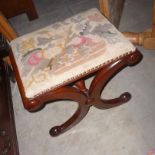 An X frame mahogany stool,  with floral needlepoint cover