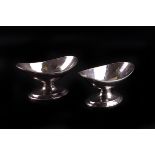 A pair of George III silver pedestal salts by George Burrows I, London 1800, the oval crescent bowls