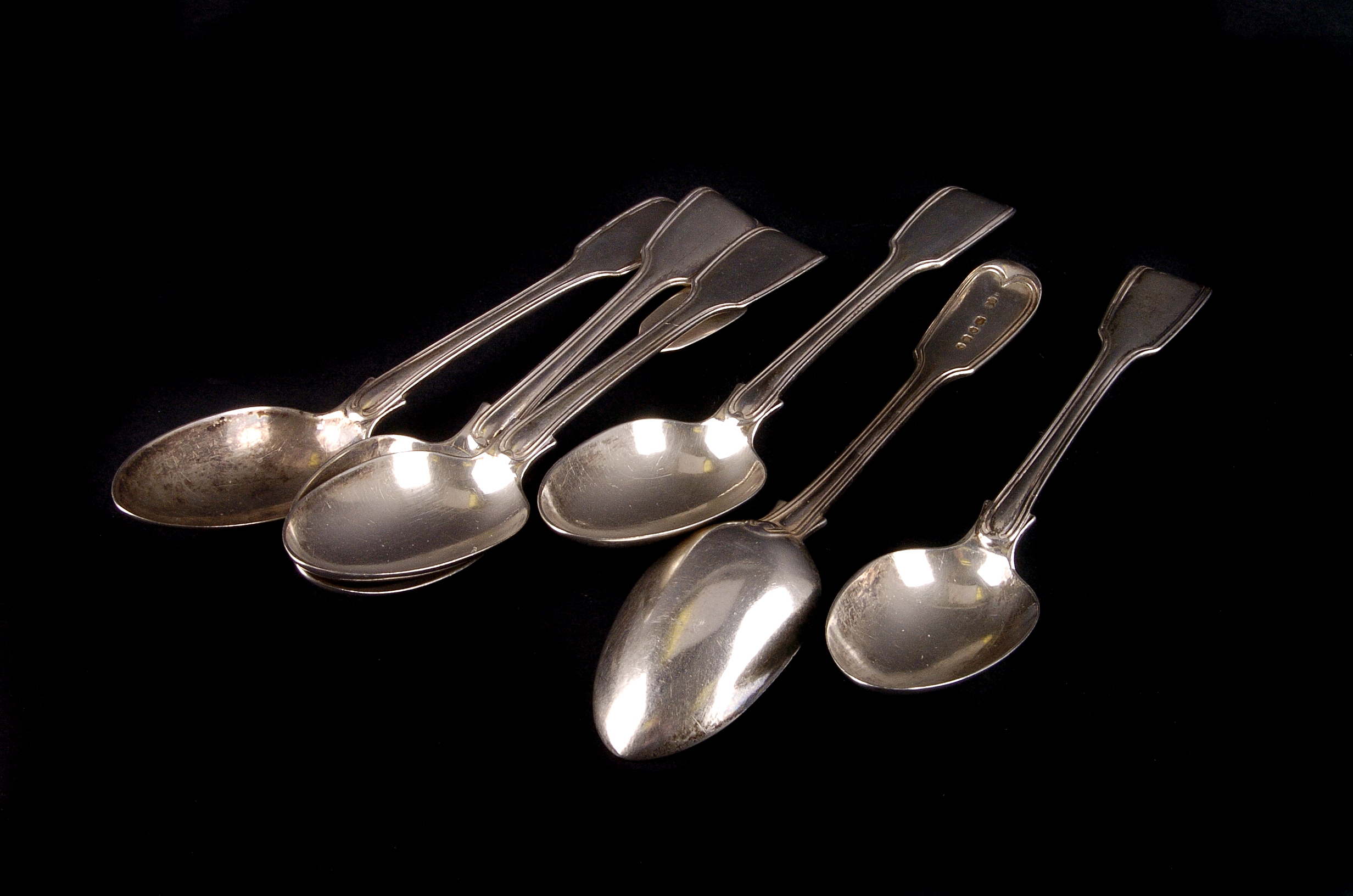 A set of six Victorian silver fiddle and thread pattern dessert spoons by George Adams,  London