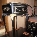 A pair of 1960s ebonised bow front bedside tables,  with brushing slides and faux ormolu mounts,