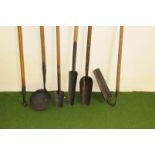 A group of six vintage drain and other farm long handled tools, including a bowl, an angle scoop,