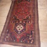 A Persian Tabriz runner,  with multi border to a central medallion, 111 x 325cm
