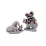 A group of Lladro polar figure groups, including children riding a polar bear, bear cub and girl,