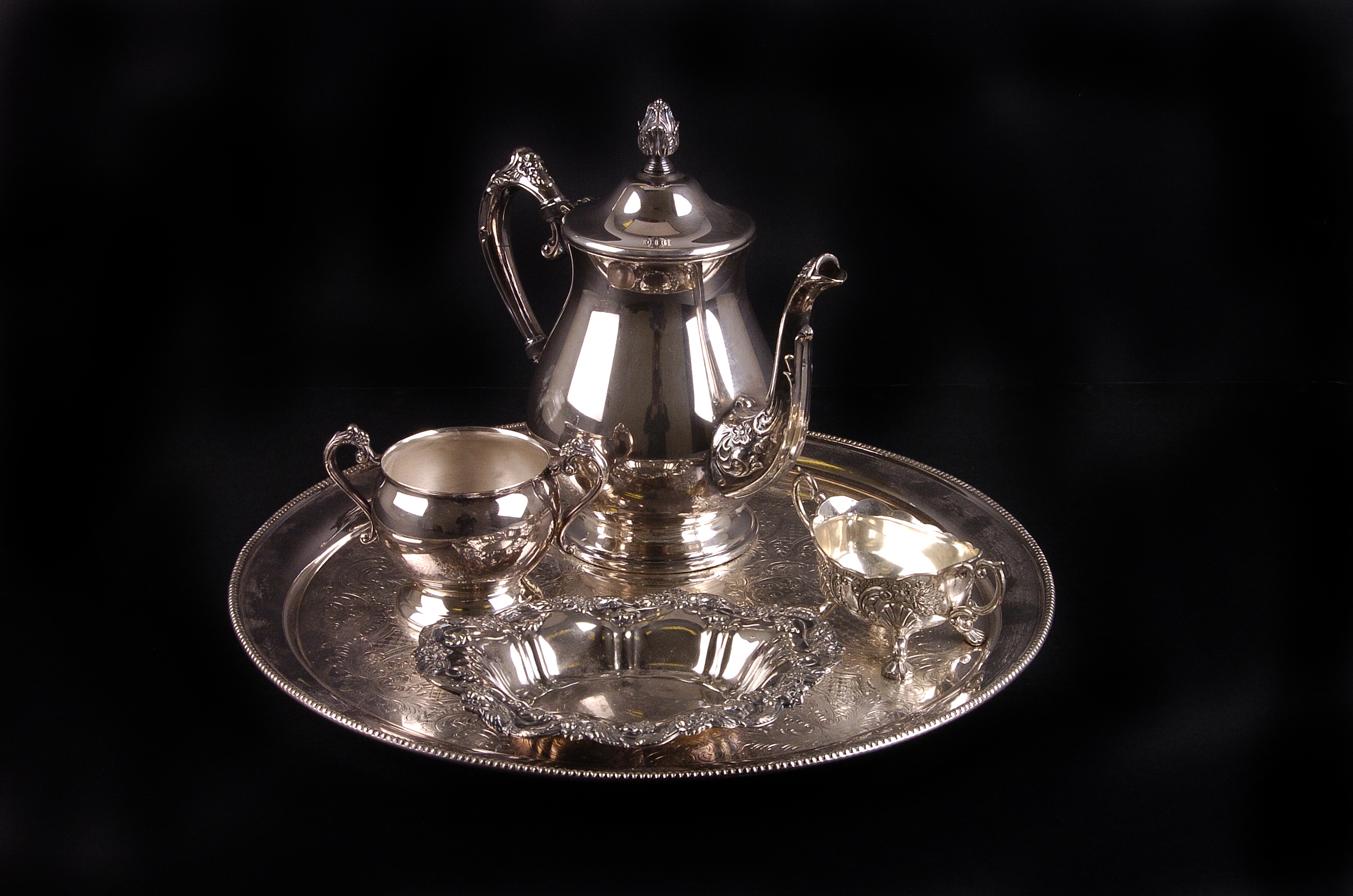 A quantity of electroplated items,  including a sugar caster, circular tea pot, bon bon dishes,