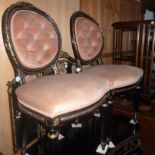 A pair of 1960s ebonised cameo back bedroom chairs,  with faux ormolu decoration and on  fluted