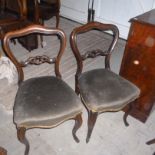 A set of six Victorian mahogany balloon back  dining chairs,  with green velour stuff-over seats and