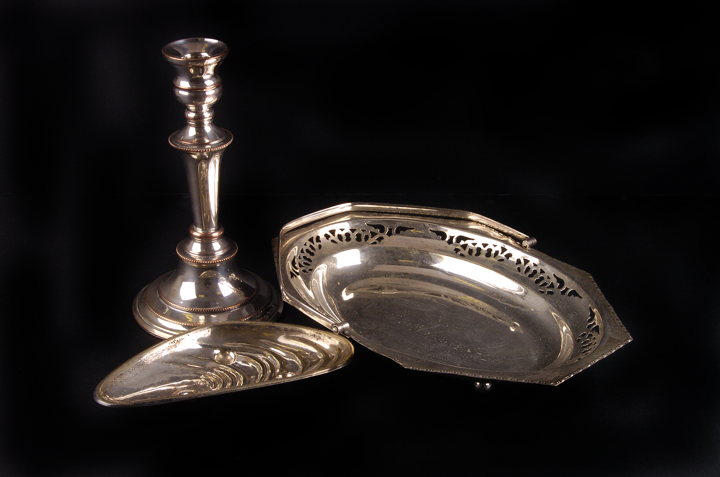 A group of silver plated items,  including a pair of twin branch candelabra, serving dishes and