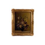An oil on canvas of a vase of flowers,  39 x 50 cm, in an ornate gilt frame