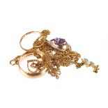 A small group of 9ct gold jewellery,  including two rings, an amethyst and diamond pendant, and