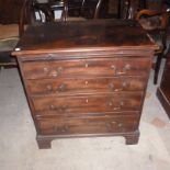 A George III mahogany bachelor's chest, of four graduated drawers and brushing slide over square