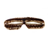 A pair of 19th century Inuit snow goggles, carved from a piece of caribou antler c.1880 13cm W