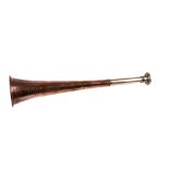 A nickel mounted copper hunting horn, marked to the body ‘Swaine & Adeney 185 Piccadilly London’