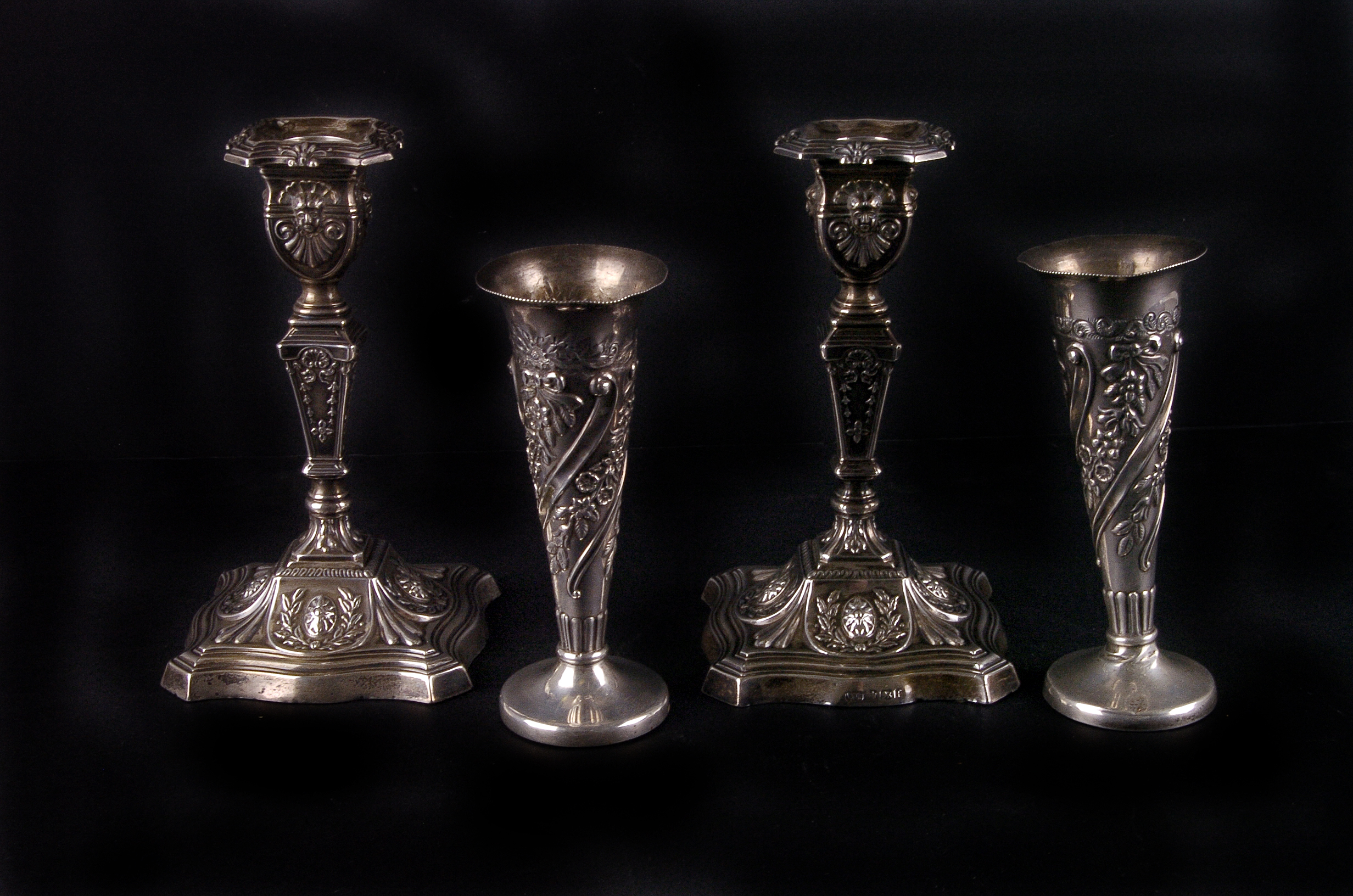 A pair of George V neoclassical candlesticks, Sheffield 1923 by Walter Trickett, together with a