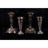 A pair of George V neoclassical candlesticks, Sheffield 1923 by Walter Trickett, together with a