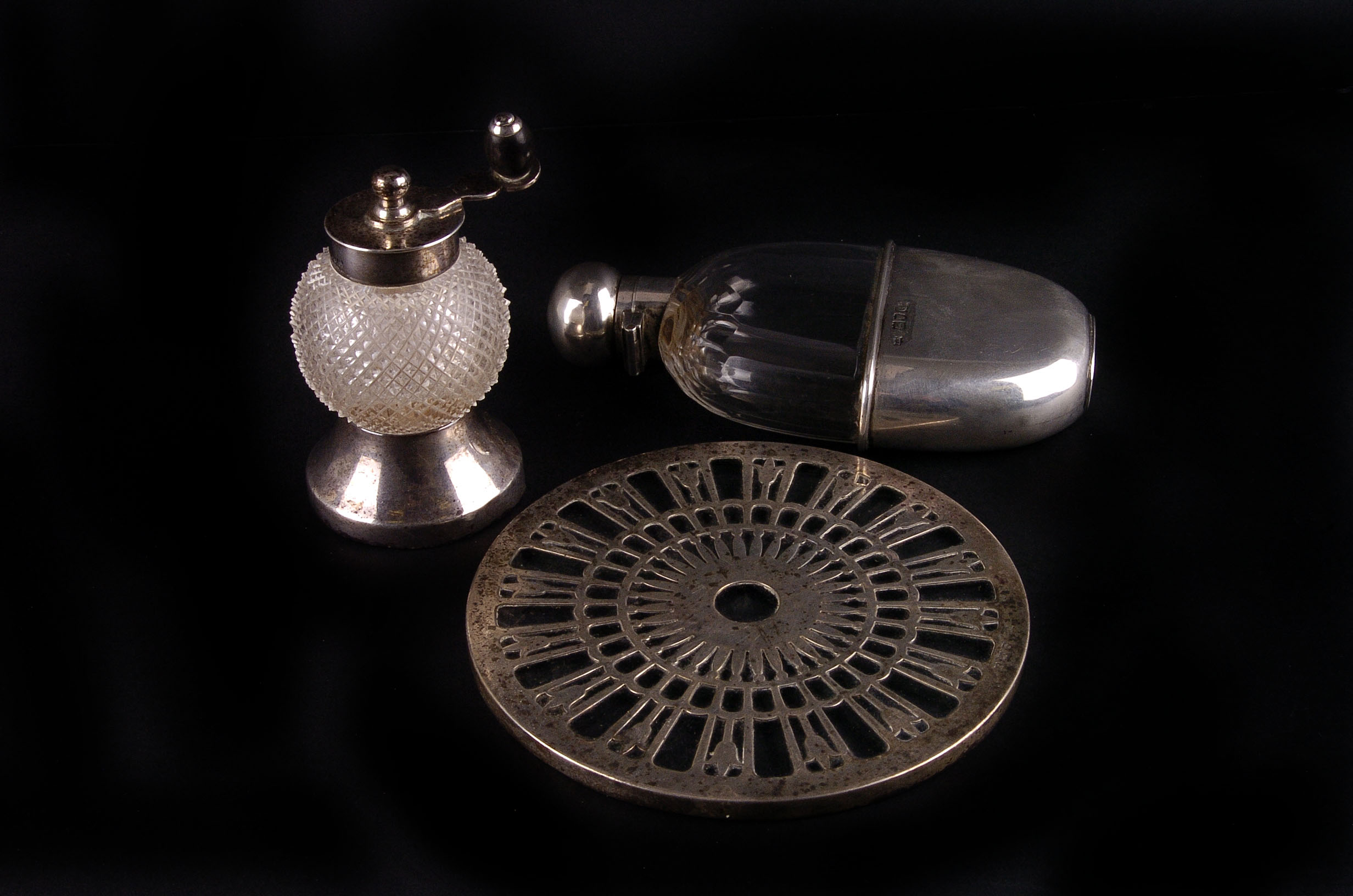 A lead crystal and silver mounted hip flask, London 1898 by Mappin & Webb, together with a hobnail