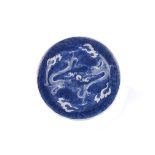 A 19th century Chinese porcelain charger, decorated in blue and white with two dragons in pursuit of