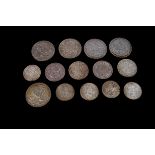 A group of fourteen 20th century coins, including three 1935 crowns, a 1937 crown, a 1951 crown,