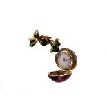 A late 19th century Swiss gold, enamel and diamond locket watch, the body in the form of a red