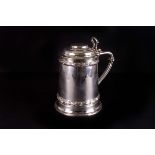 A Victorian silver tankard, London 1866 by Noah Wright, with pierced thumb scroll and decorated with
