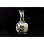 A late 18th century Chinese porcelain bottle vase, decorated with dragons pursuing the pearl of