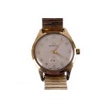 A 1960s Garrard gentleman’s 9ct gold dress watch, the silvered dial with applied gold Arabic