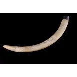 An Edwardian silver mounted carved ivory tusk, the mount London 1905, carved over most of its length