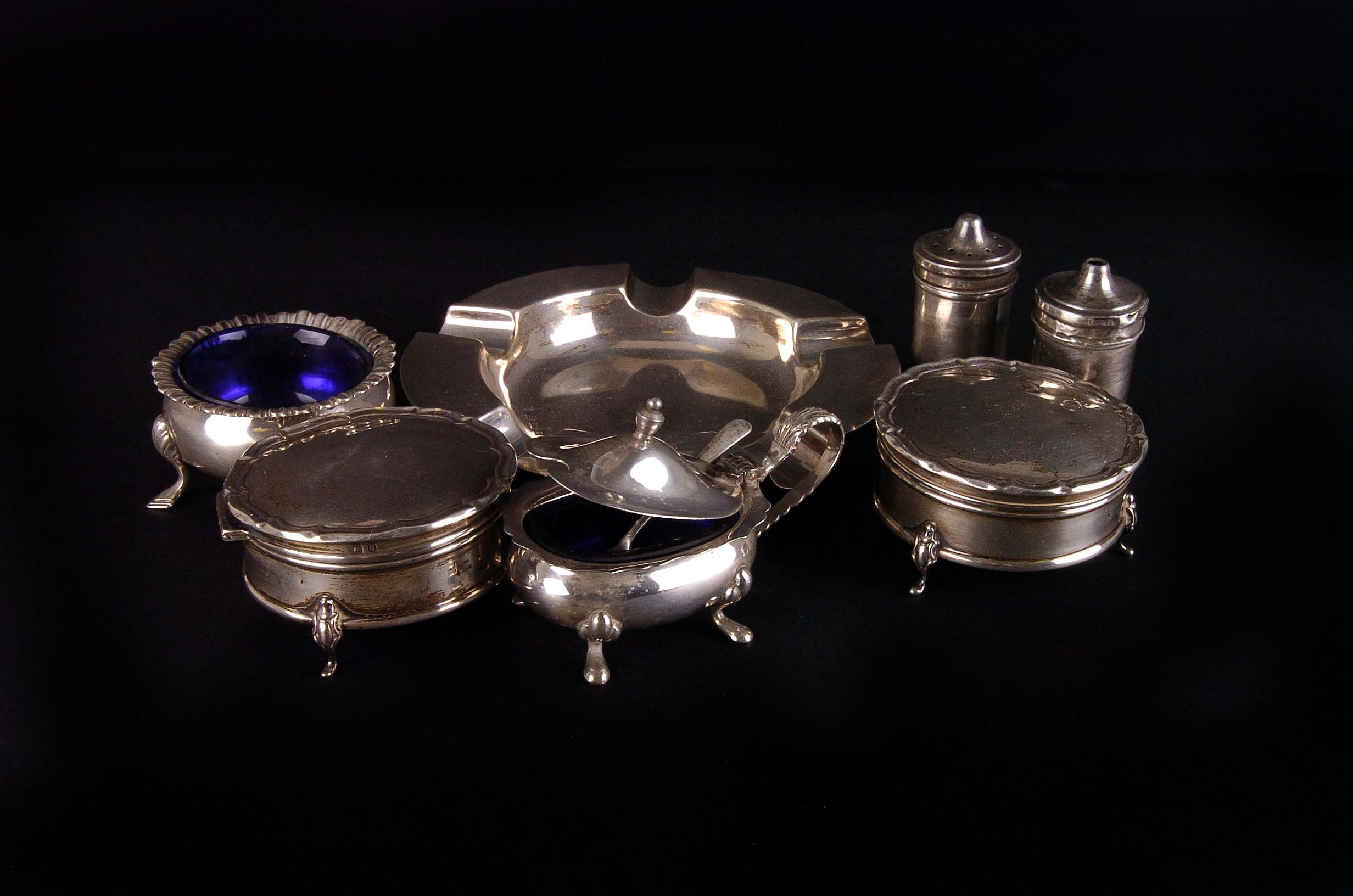 A collection of silver, including an ashtray, jewellery boxes, and cruet items 14ozt. gross