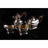 A silver four piece tea set, London 1902, indistinctly marked 34ozt.