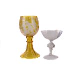 A mid-19th century Bohemian glass Roemer, with yellow skin incised with putti, grape and vine