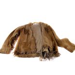 An early to mid-20th century native American buck skin jacket, with similar buck skin fringed