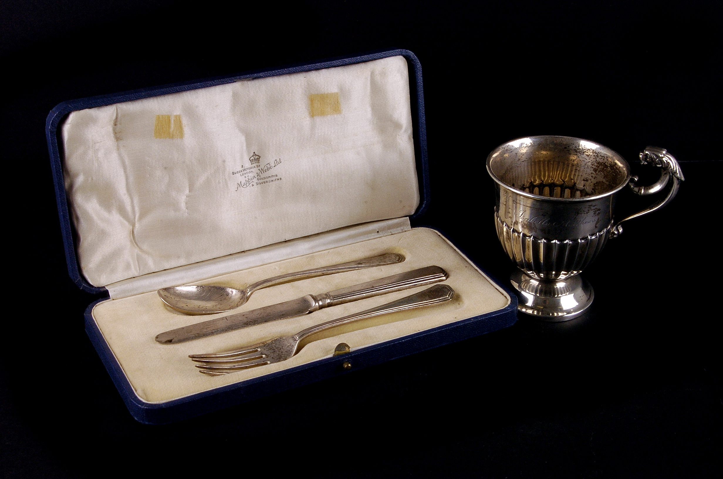 A late Victorian silver pedestal christening tankard, with lion handle and fluted bowl, London