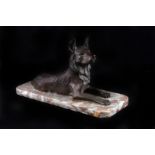 An Art Deco animalier bronze of an Alsatian,  on a two tone marble base, 24cm long