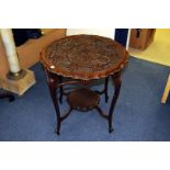 An Edwardian mahogany occasional table, the shaped circular top with moulded grape and vine