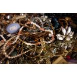 A quantity of costume jewellery,  including aurora beads, a Wedgwood jasper ware brooch, various