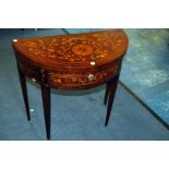 A 19th century mahogany and marquetry inlaid tea table, the demi-lune hinged top on four tapered