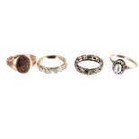 A group of four rings, including a 9ct gold signet ring, a 9ct gold half hoop and a 9ct gold full