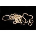 Three single string cultured pearl necklaces, one with a chip diamond clasp (3)