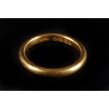 A 22ct gold wedding band, the plain ring bearing hallmarked to inner, approx. 5.7g and size N