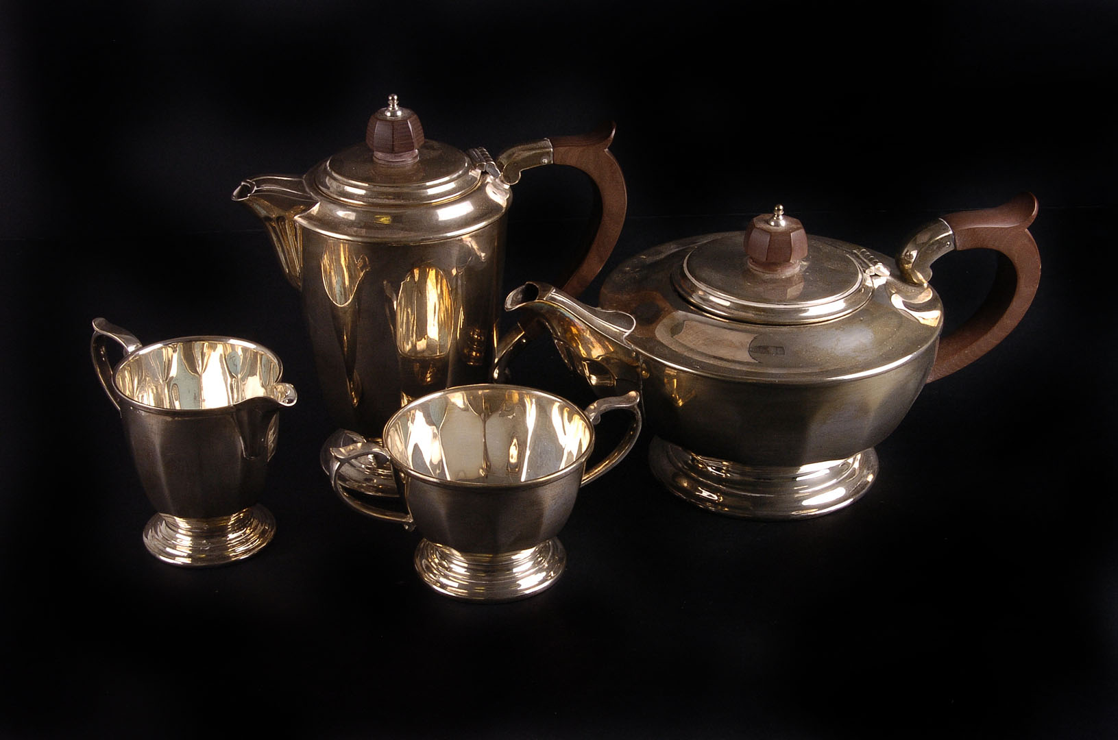 A silver three piece tea service by Mappin & Webb,  Sheffield 1969, the tea pot of compressed