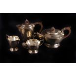 A silver three piece tea service by Mappin & Webb,  Sheffield 1969, the tea pot of compressed