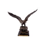 A presentation spelter figure of an eagle, with military dedication 'Presented to Major Arthur Couch